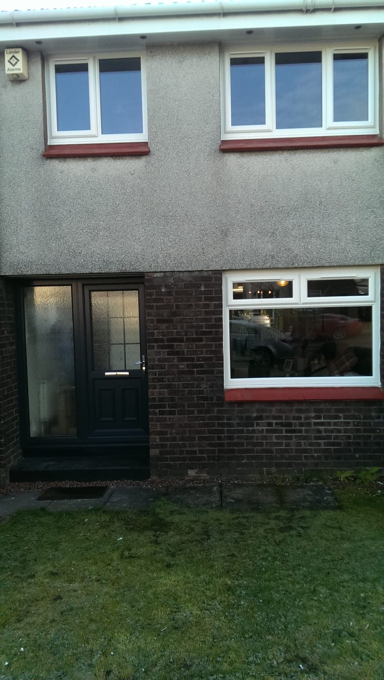 Full house exterior with black composite front door and white uPVC windows