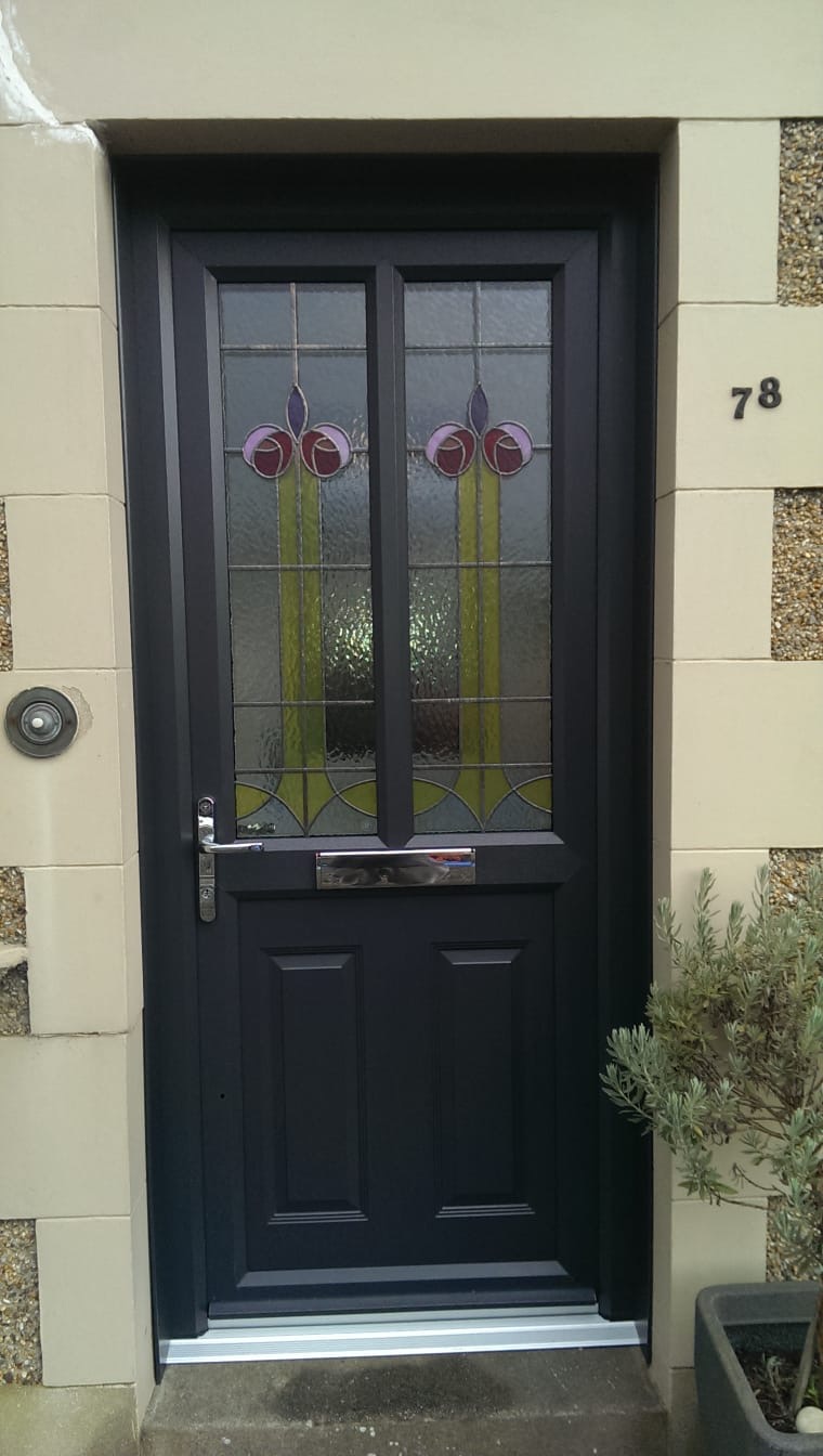 Navy composite front door with Mackintosh-style stained glass panels