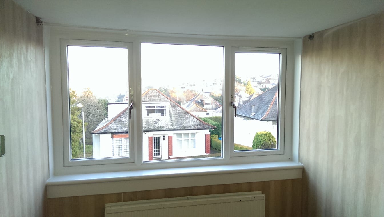 Triple white uPVC casement windows with panoramic rooftop view